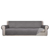 PureFit front view of 88" quilted cover protecting sofa, shows full coverage benefit