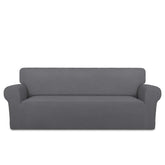 PureFit front view on large sofa showing neat gray fit and renewed look