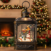 Qualdout front view of snow globe lantern showing glowing Santa scene and glitter, festive centerpiece