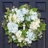 Quixem front door wreath adding welcoming spring curb appeal
