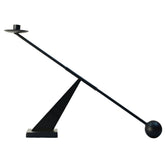 Remenna black metal candlestick front view showing sleek modern silhouette and visual impact