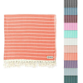 Sand Cloud front view showing Gocek Coral towel and compact size benefit