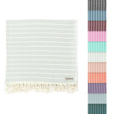 Sand Cloud folded towel front view showing sage color and compact packability