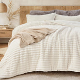 Sasttie comforter front packaging showing cream-white plush and brand reassurance