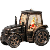 Seschrist bronze tractor snow globe front view showing festive lantern glow