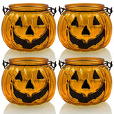 SHMILMH front view of four orange glass pumpkin holders adding festive glow