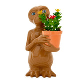 Silver Buffalo E.T. front view showing the planter and faux succulent as a playful desk accent