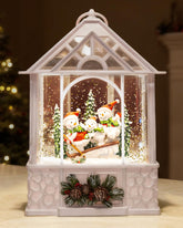 sinofayar front view of snowman snow globe lantern showing warm glow and family scene