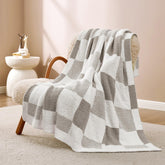 Snuggle Sac front view grey throw showcasing checkered design and cozy appeal