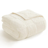 Snuggle Sac front view of ivory throw showcasing checkered pattern and elegant finish