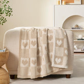 Snuggle Sac front view of beige heart checker throw showing decorative appeal and comfort