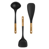 STAUB 3-piece set front view showing matte black silicone and acacia handles, elegant kitchen upgrade