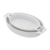 STAUB front view of both white oval baking dishes showing elegant serve-ready design