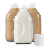 Stock Your Home front view of three glass milk bottles showing clear glass and lids for easy storage