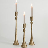SUJUN front view of three antique brass candle holders showing elegance