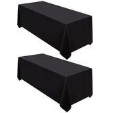 Surmente front view of two black tablecloths showing clean drape and coverage