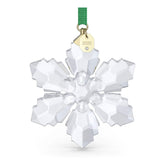 Swarovski front view showing geometric snowflake and ribbon for elegant sparkle