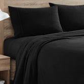 Sweet Home Collection front view of black flannel sheet set showing complete contents and tidy look