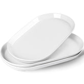 Taeochiy front view of three white oval platters, elegant serving-ready
