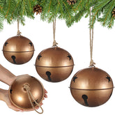 Tandefio front view of three gold bells showing size variety and festive charm