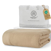 Threadmill folded blanket front view showing clean beige finish and cozy look