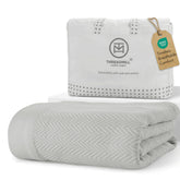 Threadmill light grey blanket front view showing elegant finish and cozy appeal