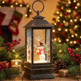TIJNN front view of globe showing warm LED light and snowman for festive ambience