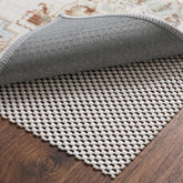 TravLand front packaging showing 9x12 rug pad and benefits
