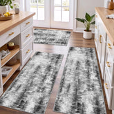 Tritard front view of three grey rugs showing modern abstract design and cohesive look