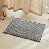 TYUU bath mat front view showing grey and white boho design and comfort