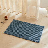 TYUU bath mat front view showing denim blue color and waffle texture for comfort