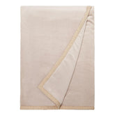 UGG Duffield Throw front folded on sofa for neat, cozy styling