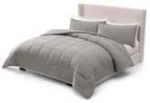 UGG Leonora front view on king bed shows plush comfort and modern seal grey style