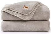 UGG Whitecap front view on couch showing soft neutral style and cozy appeal