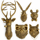 UITWMKTG front view of five gold animal heads showing cohesive gallery impact