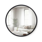 Umbra Hub front view showing round mirror and black rubber frame for modern durability