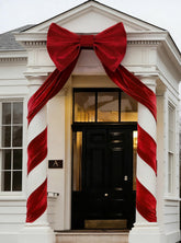 UQJE red velvet bow front view showing bold focal impact