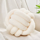 Uvvyui front view of cream knot pillow adds sculptural comfort
