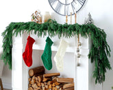 UWIOFF front view of two 6ft Norfolk pine garlands showing full festive coverage