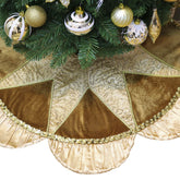 Valery Madelyn front view of golden tree skirt adds elegant base