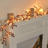 Vanthylit front view showing full red berry garland and lights for instant festive decor