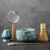 Veraelle ceramic matcha bowl front view showing cherry blossom embossing and durable glaze