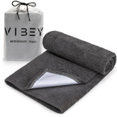 VIBEY front view showing folded towel protecting mattress and packaging benefit