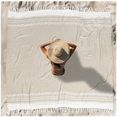 Vikumond folded front view showing compact packability and neutral beige comfort