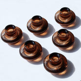 VOHO front view of six amber candlestick holders showing warm tone benefit
