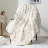 Wemore front view of blanket showing jacquard face and white color, enhances decor