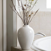 Willowy front view of glossy porcelain vase showing clean silhouette and elegant look