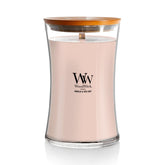 WoodWick hourglass front view showing elegant jar and warm glow benefit