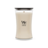 WoodWick Patchouli Crème front packaging showing hourglass jar and label benefit: stylish display