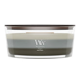 WoodWick Warm Woods front view showing ellipse jar and warm glow benefit cozy ambiance